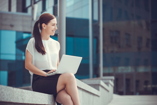 Tech savvy banker working on a laptop