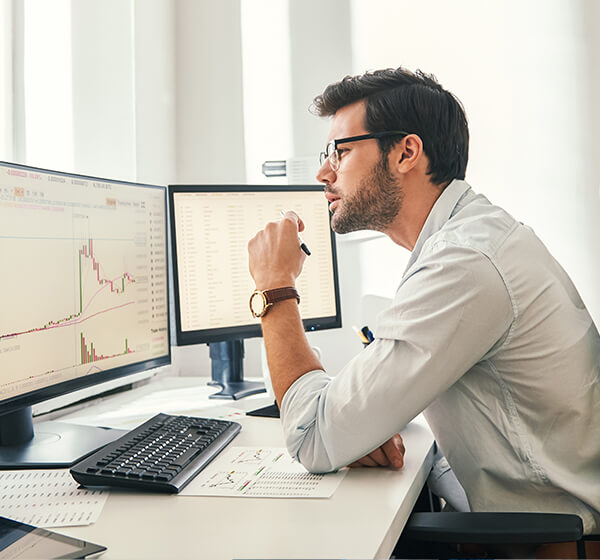 man looking at data on computer