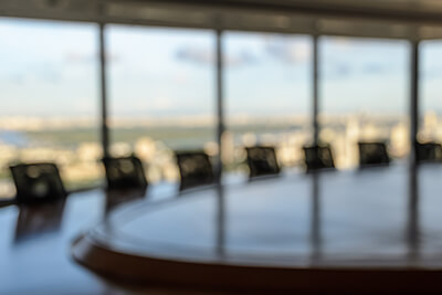 empty board room where bank executives discuss their commercial loan origination solution