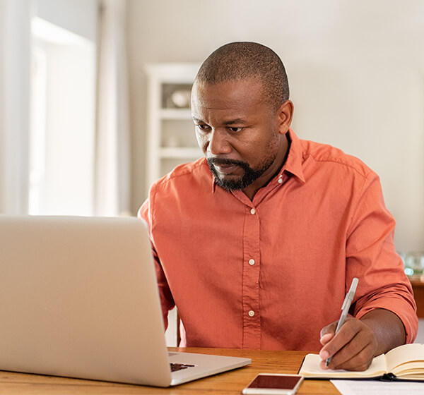 man using computer at table